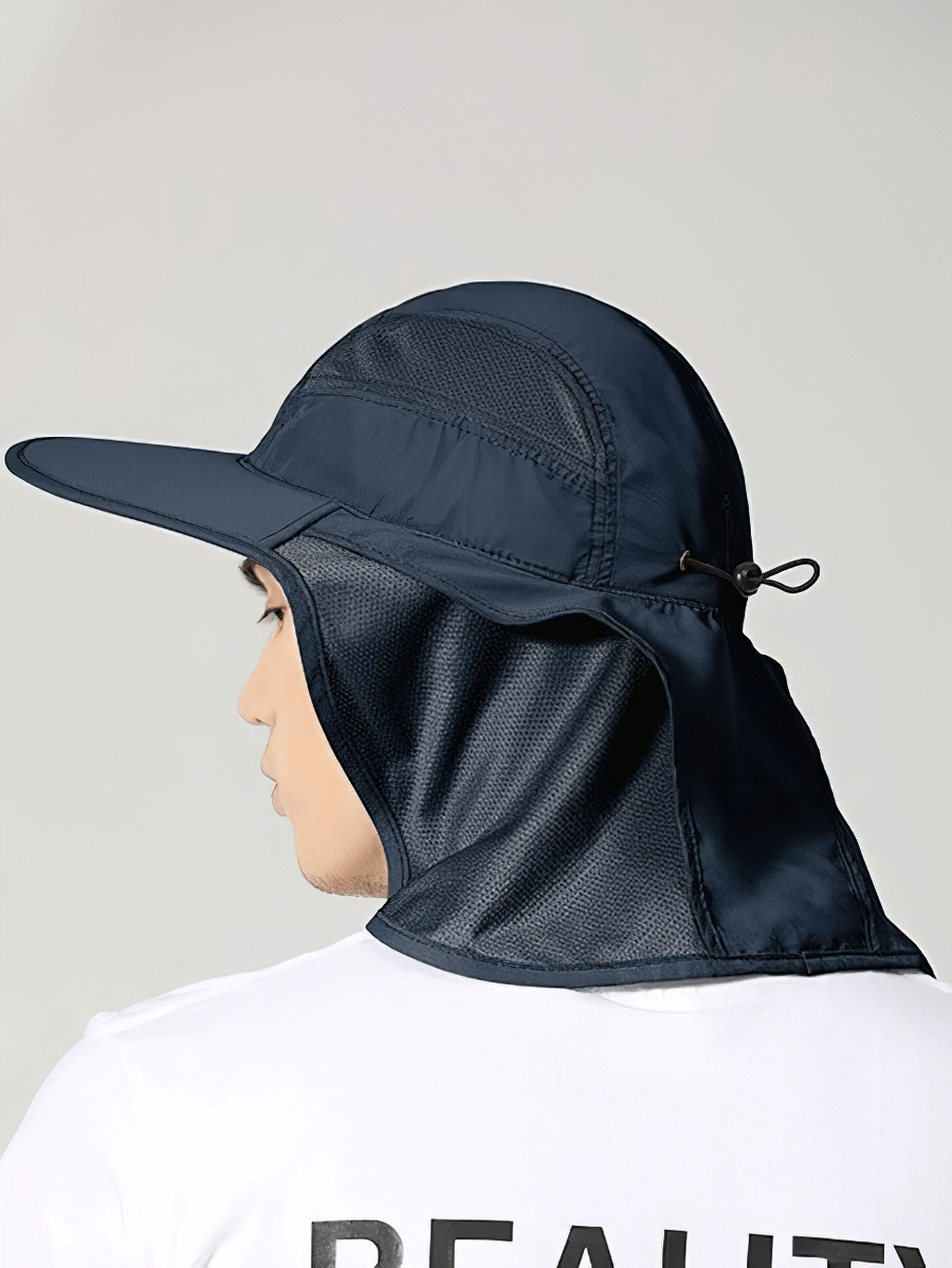 Alt Tag: Man wearing a navy wide-brimmed UV sun hat with neck protection, showcasing its unisex design and UPF 50+ protection.