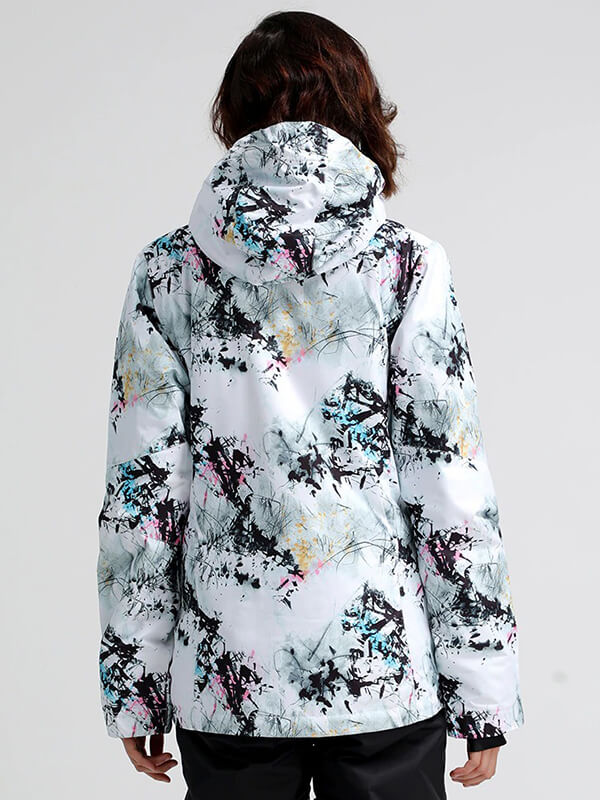 Woman wearing trendy snowboarding jacket with abstract print and hood, perfect for outdoor adventures in cold weather.