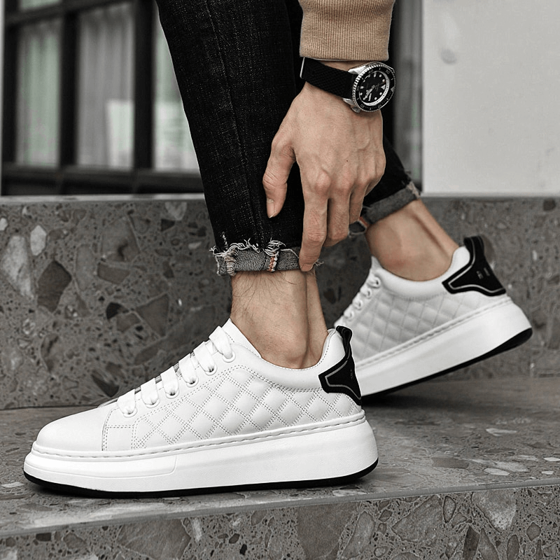 Stylish men's sneakers with genuine leather uppers, lace-up design, and rubber outsole. Perfect for casual comfort and secure grip.