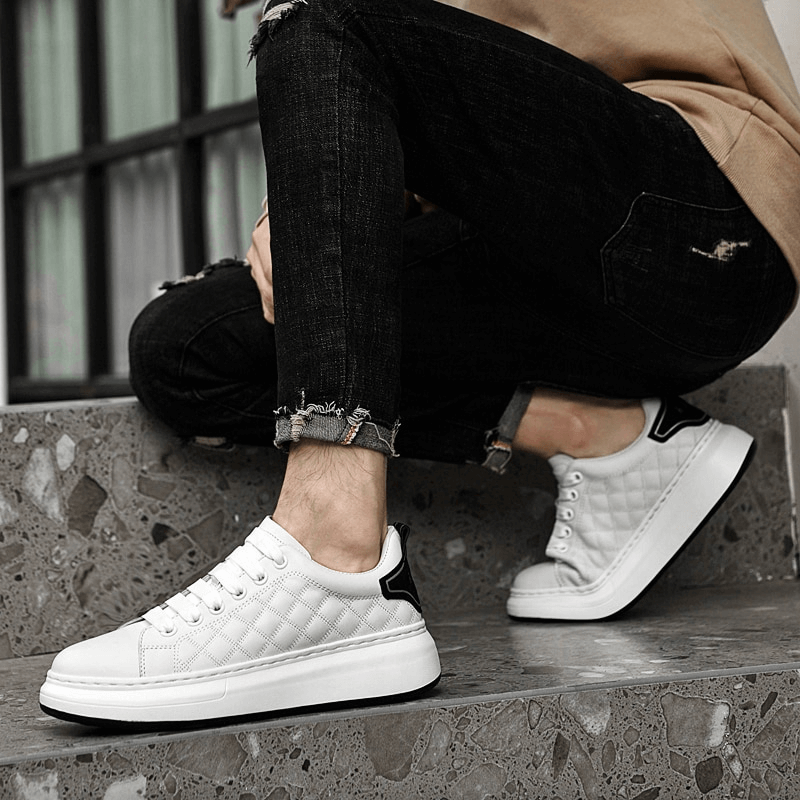 Fashionable breathable casual men's sneakers SF1171 with genuine leather uppers, worn by a model sitting on stairs, showcasing style and comfort.