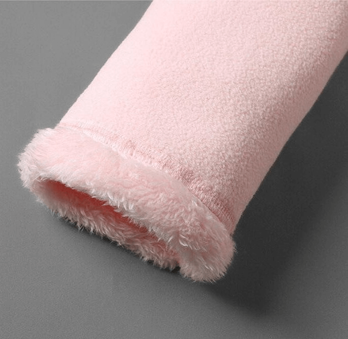 Close-up of pink double-sided fleece jacket sleeve, showcasing soft, thermal fabric texture.