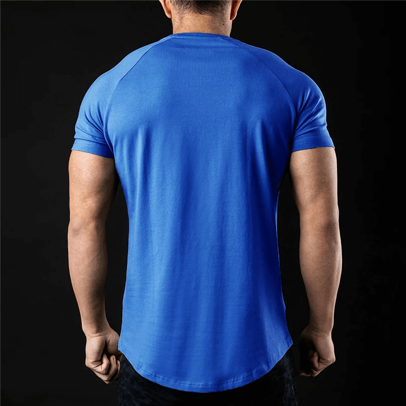 Back view of a model wearing a blue lightweight sporty men's short-sleeve T-shirt, designed for training and comfort.