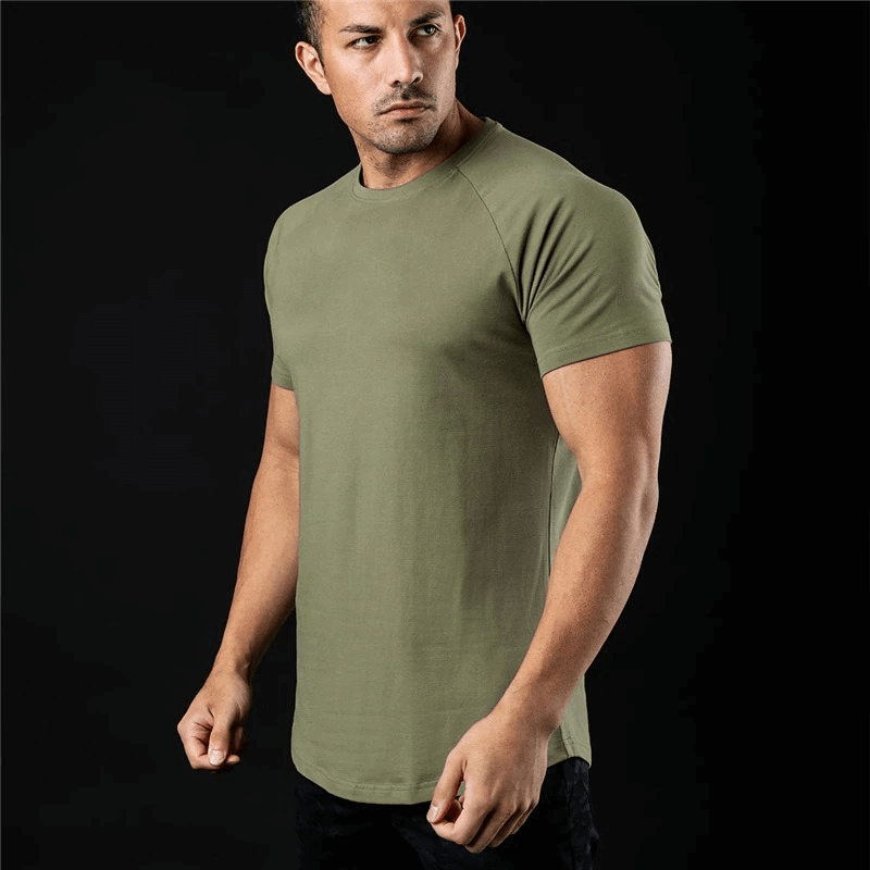 Model wearing a fashionable lightweight sporty men's T-shirt for training, featuring O-neck collar and short sleeves in solid olive color.