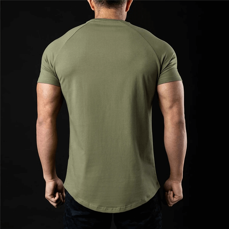 Back view of a man wearing a fashionable lightweight sporty men's t-shirt in solid color, perfect for training and workouts.