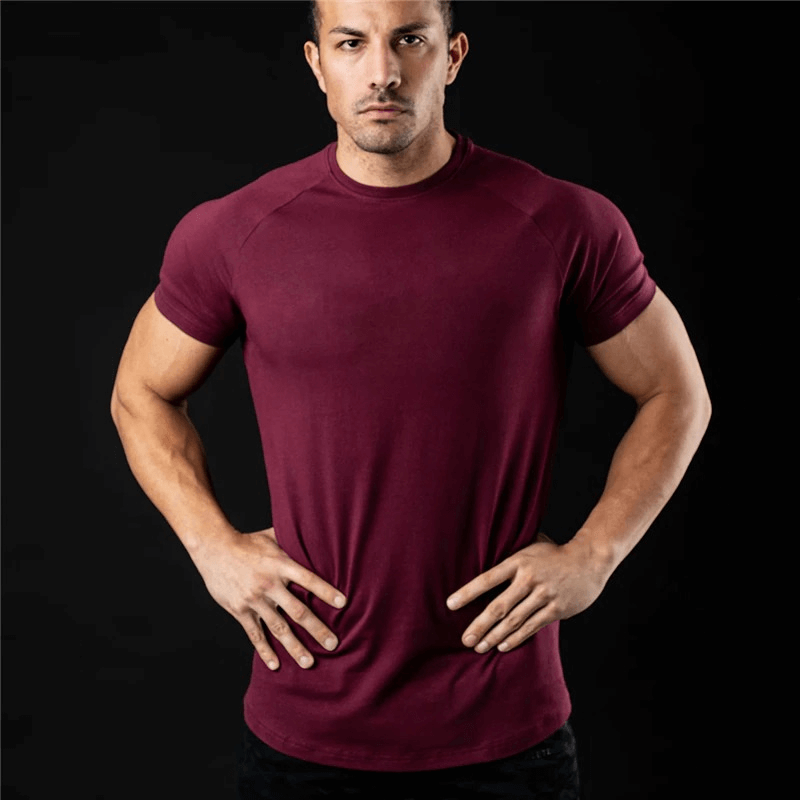 Fashionable lightweight maroon men's t-shirt with O-neck design, perfect for training. Breathable, quick-drying, and stretchy.