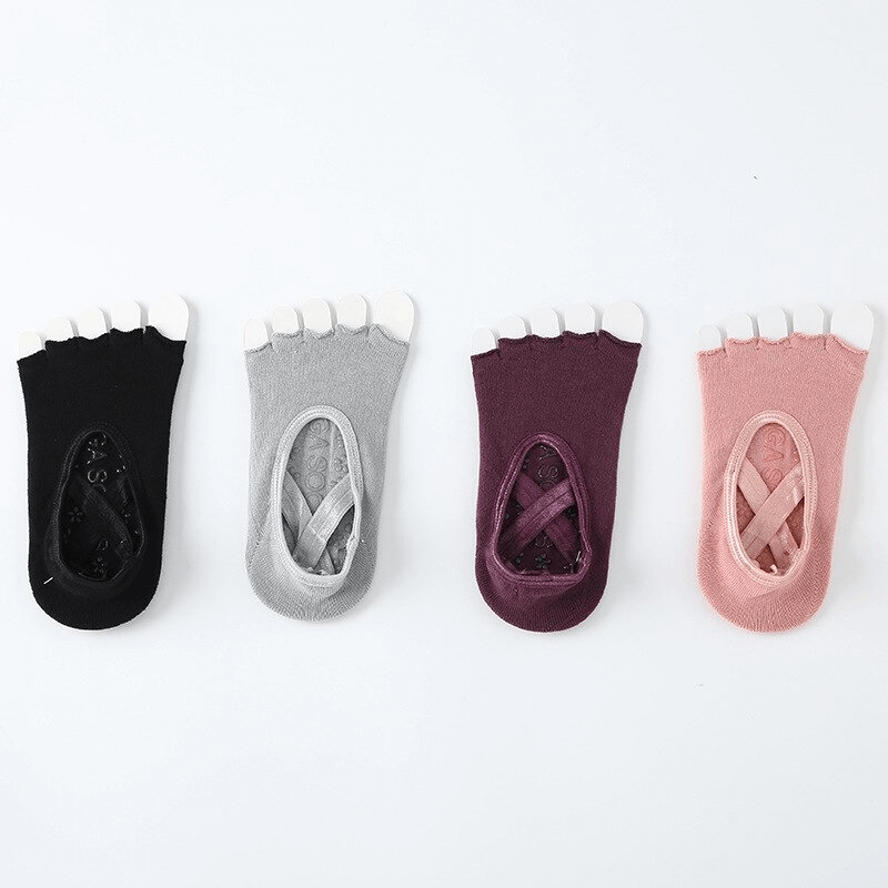 Set of four fashionable non-slip women's sports socks with open toes in black, gray, purple, and pink.