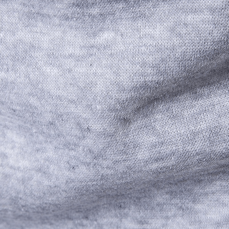 Soft grey fabric texture close-up, showcasing comfort and quality of the cotton-polyester blend in men's casual vests.