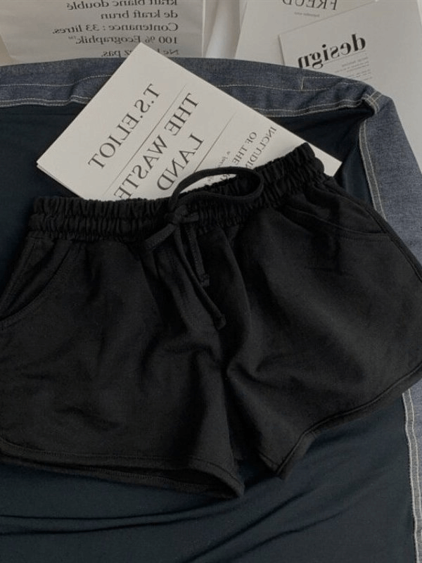 Black women's high-waist loose shorts with elastic waist, made of a comfy cotton-polyester-spandex blend, perfect for casual wear.