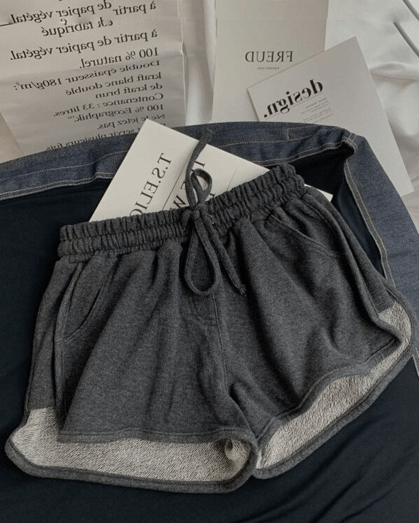 Fashionable women's high-waist loose shorts with elastic waistband, designed for comfort and style in solid gray color, perfect for any occasion.