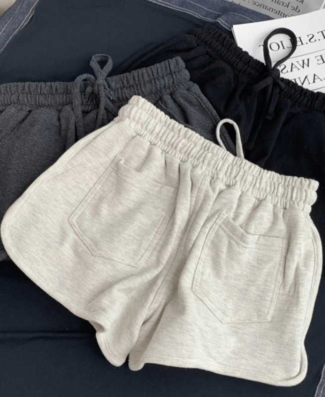 Fashionable women's high-waist loose shorts with elastic waistband in soft cotton blend, perfect for versatile casual wear.