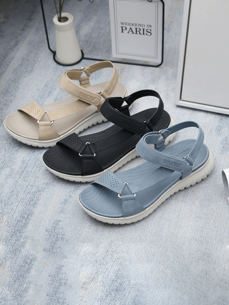 Fashionable women's sports platform sandals with adjustable buckle in beige, black, and blue on light background
