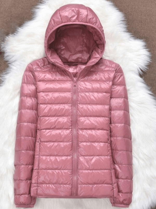 Fashionable pink ultralight hooded jacket for women with premium down insulation, perfect for style and warmth.