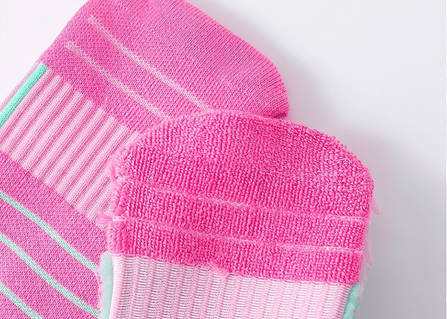 Close-up of pink Fast-Drying, Breathable Basketball Knee-High Socks showcasing texture and vibrant colors, perfect for active players.