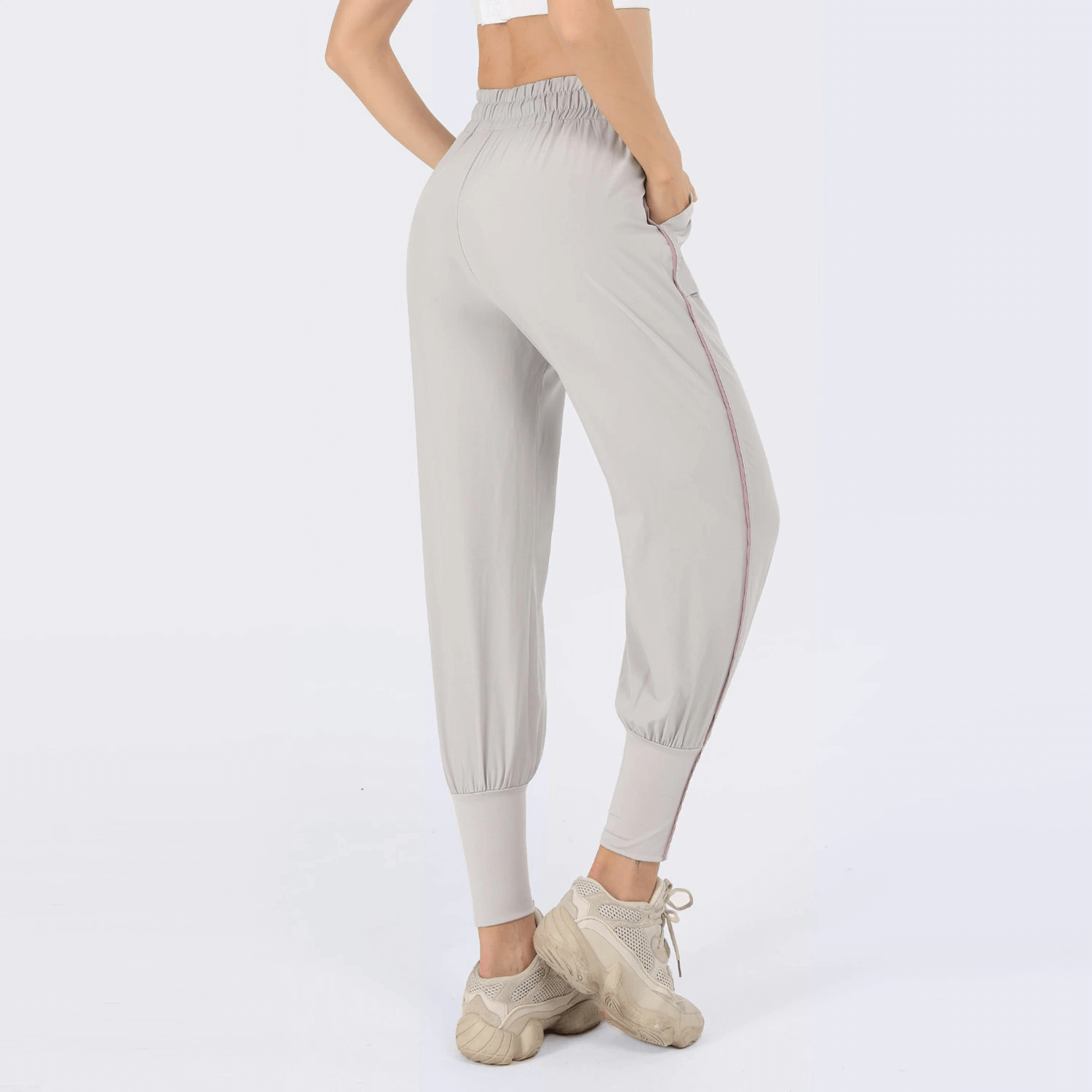 Female wearing grey drawstring waist jogging pants
