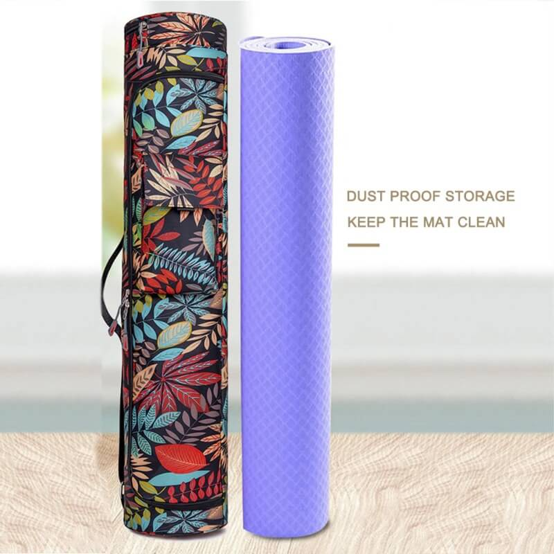 Colorful printed yoga bag with zipper next to a purple exercise mat, ideal for pilates and yoga gear storage.