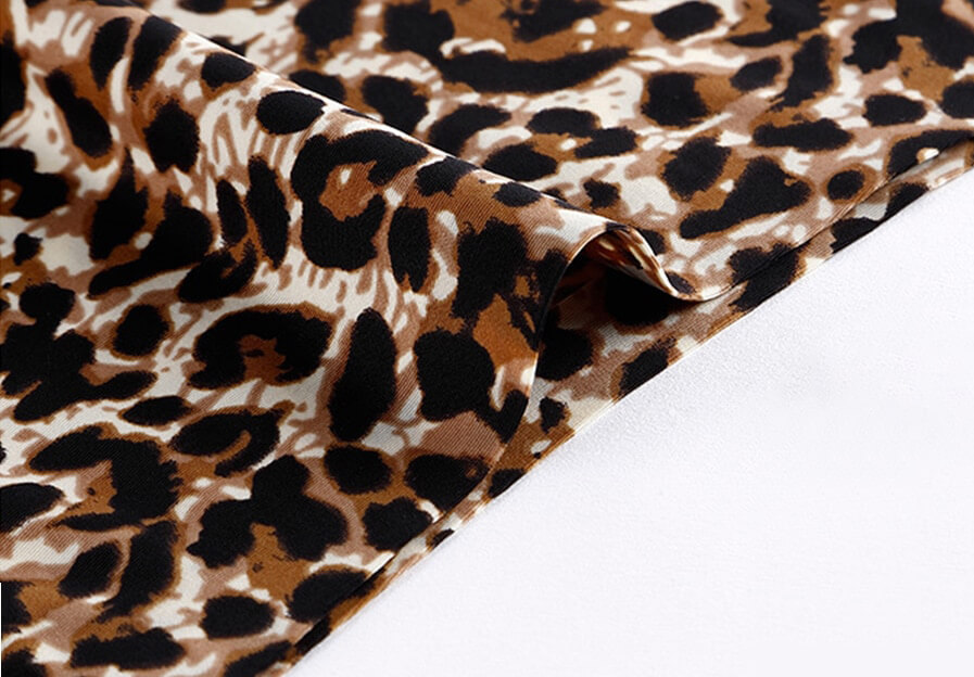 Close-up of leopard print seamless briefs fabric, highlighting its stylish pattern and soft texture for a chic look.