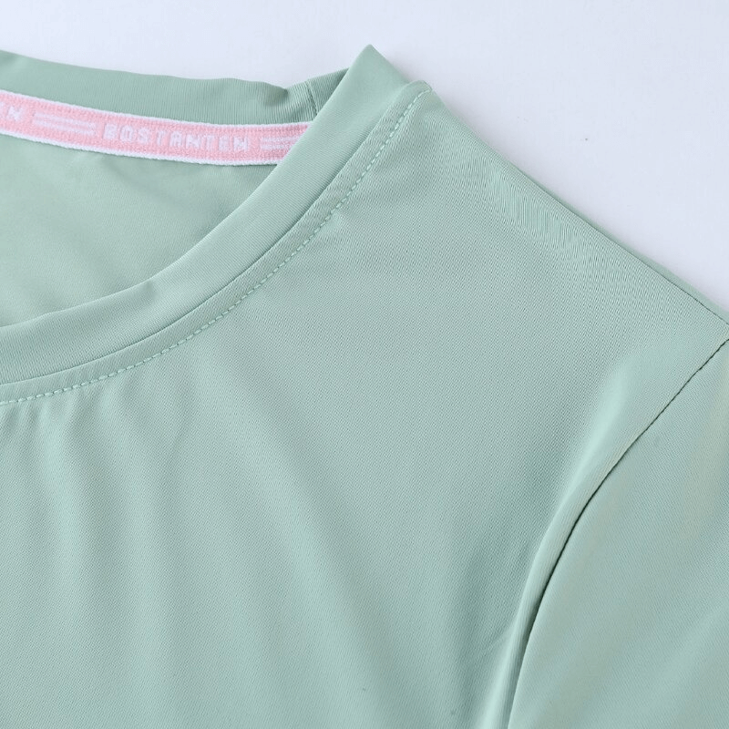 Mint green sports asymmetrical T-shirt, slim fit with short sleeves, ideal for yoga and running. SF0099 female fashion top detail.