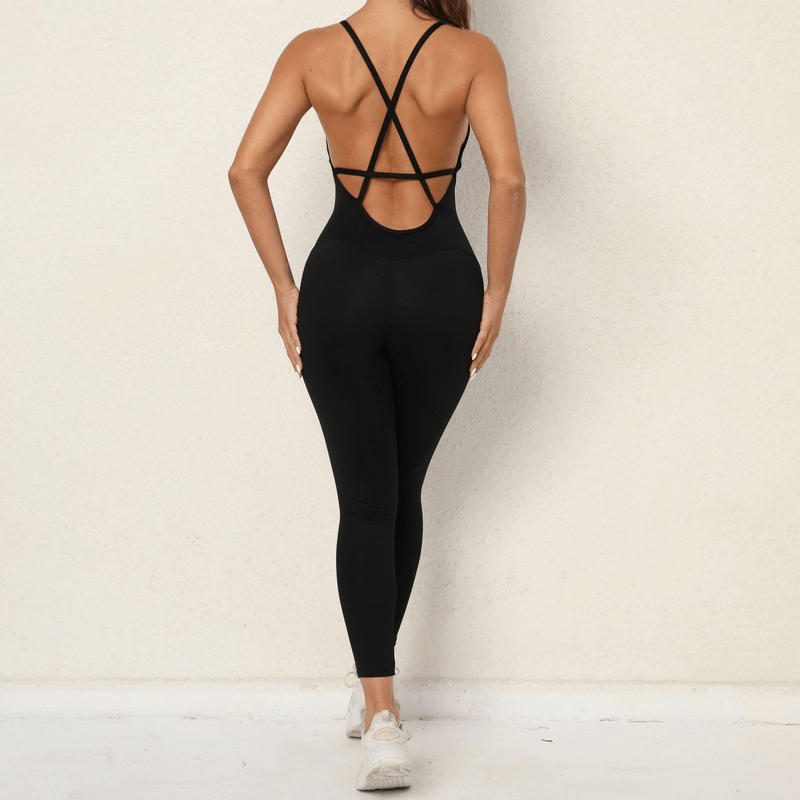 Back view of a black seamless v-neck yoga jumpsuit with open back design, ideal for workouts. Anti-wrinkle, breathable nylon fabric.