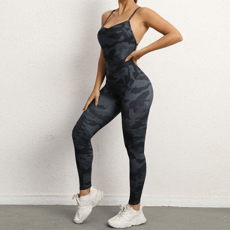 Woman in camo pattern seamless yoga jumpsuit with V-neck and open back, perfect for workouts. Comfortable, breathable, stylish activewear.