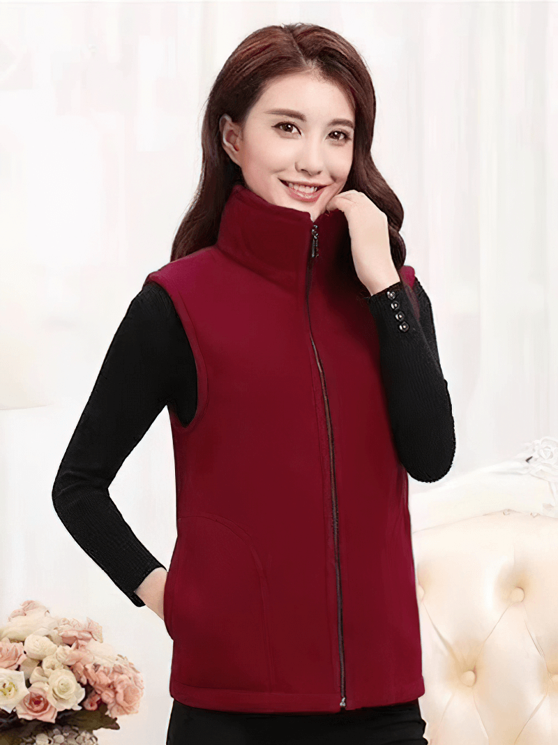 Woman wearing a cozy fleece warm zipper vest with pockets in red, showcasing stylish comfortable women's clothing.