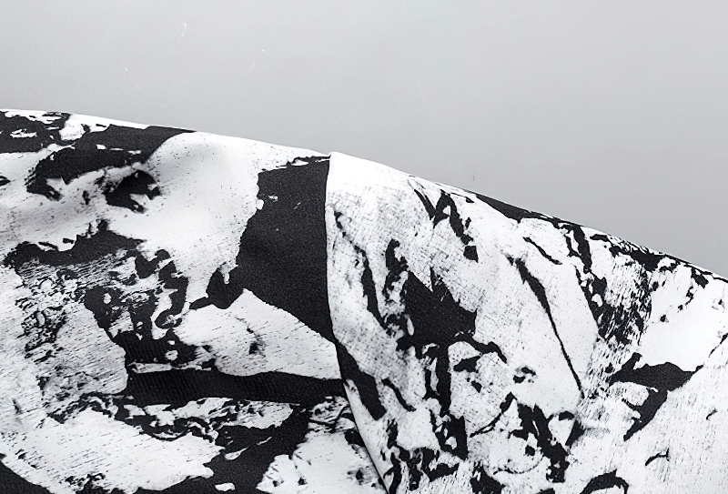 Close-up of print design on female zipper hooded jacket, lightweight polyester windbreaker SF0910, showcasing unique pattern.