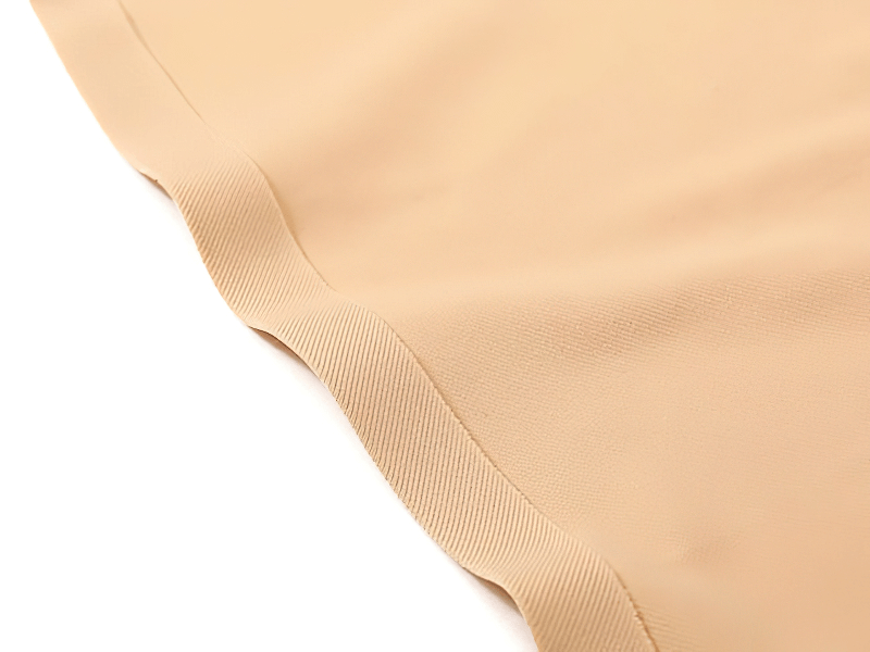 Close-up of seamless solid color low-rise female briefs, showcasing sleek stitching and smooth fabric texture for comfort and flexibility.
