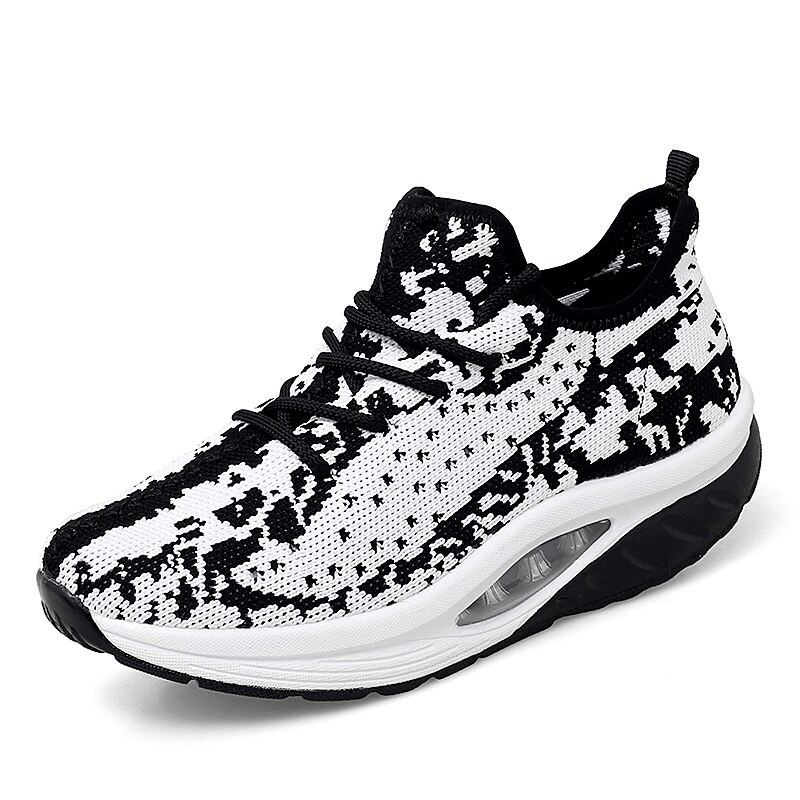 Stylish black and white lace-up platform sports sneaker for women, featuring breathable mesh upper and cushioned EVA insole for comfort.