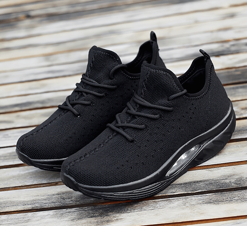 Sleek black lace-up platform sports sneakers, featuring breathable mesh upper and cushioned EVA insole for fitness and everyday comfort.