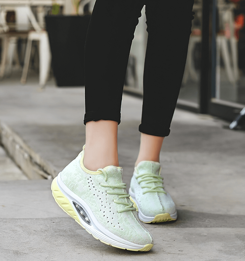 Fitness Women's Lace-up Platform Sports Sneakers SF0253 in action, showcasing lightweight mesh design and EVA cushioning on a sidewalk.