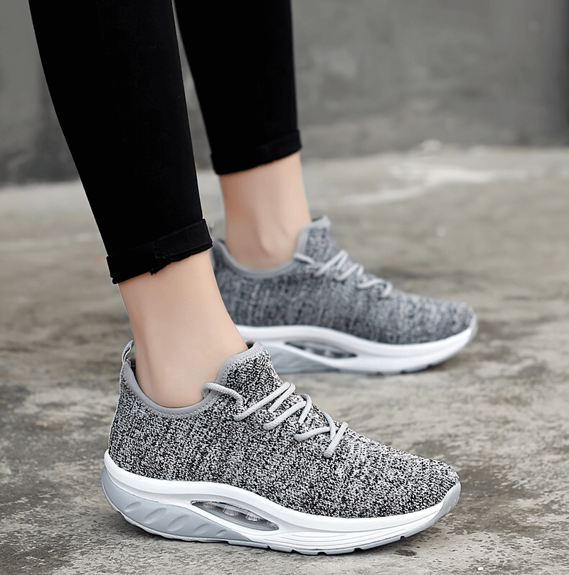 Stylish women's gray lace-up platform sports sneakers with breathable mesh design, perfect for fitness and casual wear.