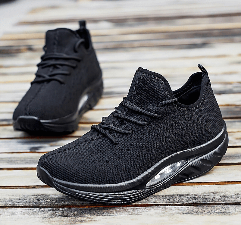 Black lace-up platform sports sneakers for women with breathable mesh and EVA cushioning, ideal for fitness and everyday style.