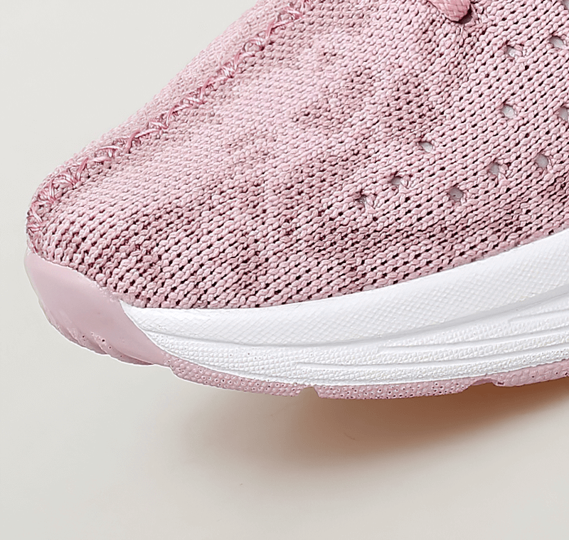 Close-up of pink Fitness Women's Lace-up Platform Sports Sneaker with breathable mesh design and white EVA sole