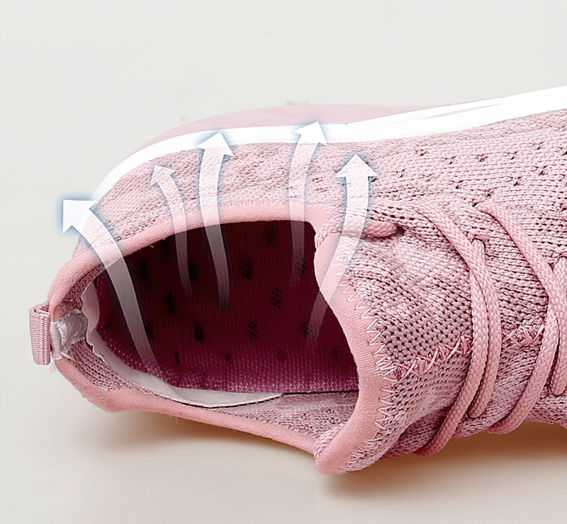 Breathable pink lace-up platform sports sneaker with arrows indicating air flow through the mesh upper. Model SF0253 for women.