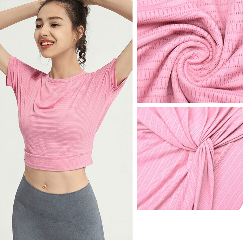 Woman wearing pink fitness crop top with backless design, showcasing fabric details for stylish gym sportswear in yoga or running.
