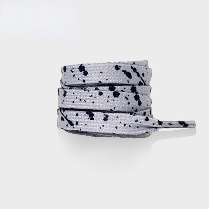 Flat durable colorful shoelaces SF1130 with black splatter pattern, perfect for sports shoes, made of premium polyester.