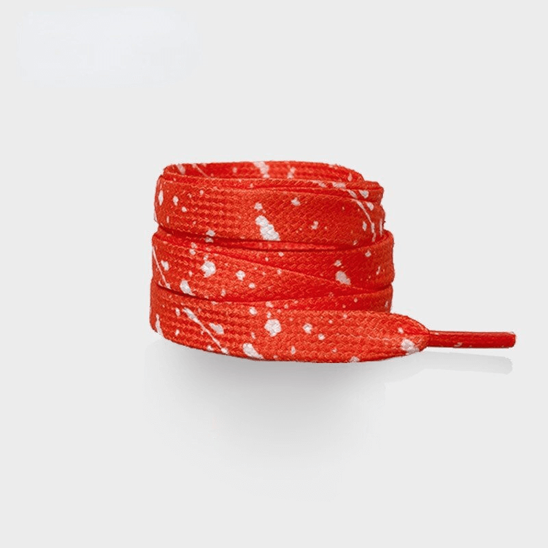 Bright red flat durable shoelaces with white speckles, perfect for sports shoes; made of polyester for secure, stylish fit. Unisex design.