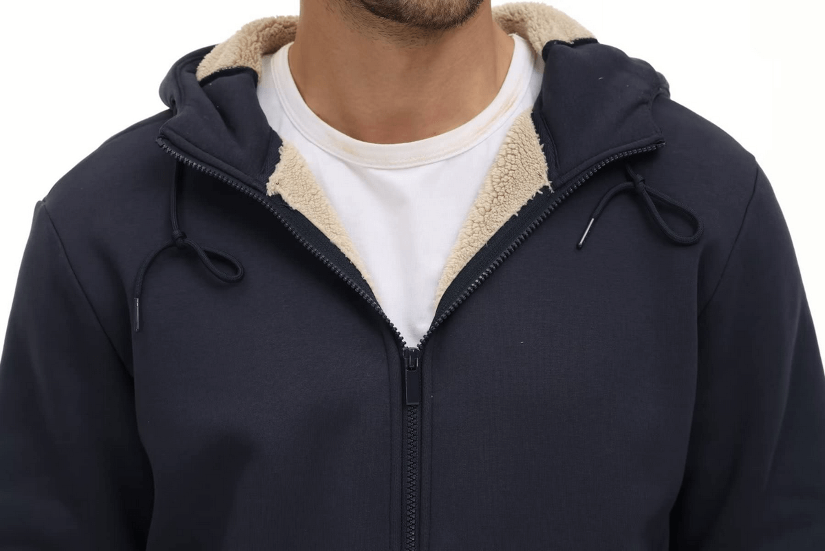 Man wearing a navy Fleece Lining Zipper Sherpa Jacket with hood and pockets, casual sportswear style.