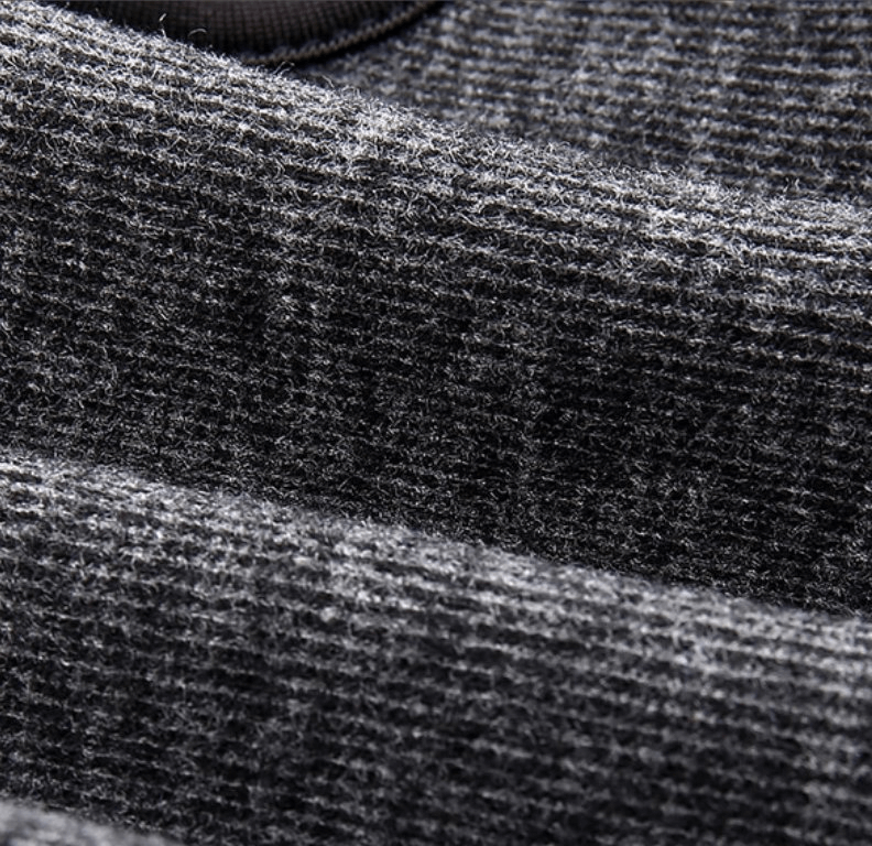 Close-up of fleece material on a windproof face mask, showcasing its breathable, UV-blocking polyester fabric and adjustable design.