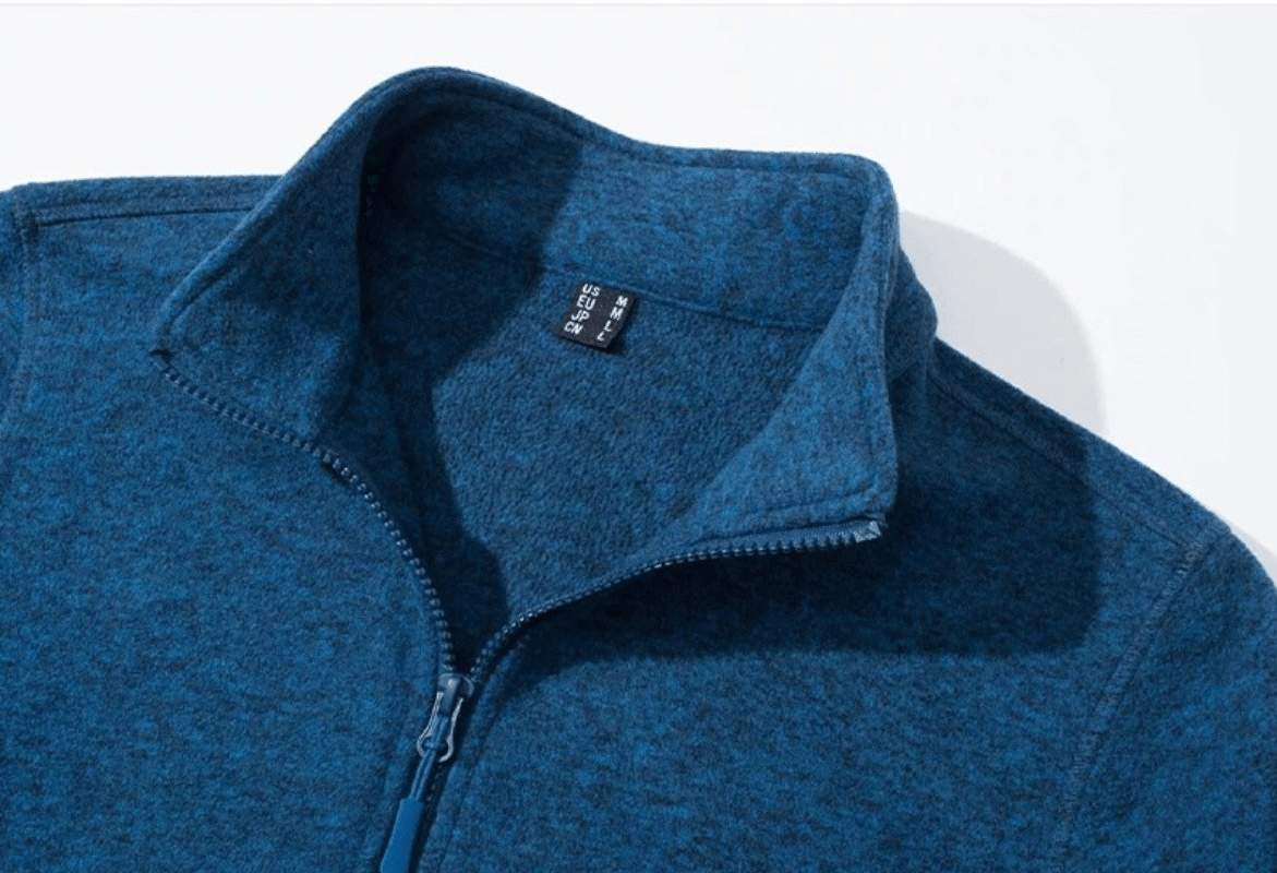 Close-up of a blue fleece women's running sweatshirt with a stand collar and zipper, designed for warmth and style, SF0127.