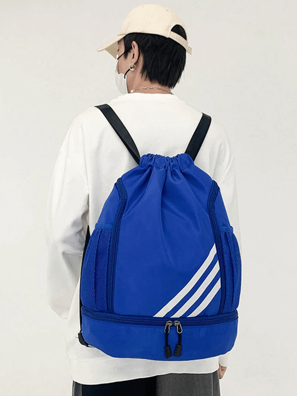 Person wearing a blue gym drawstring bag with white stripes, perfect for fitness and basketball activities.