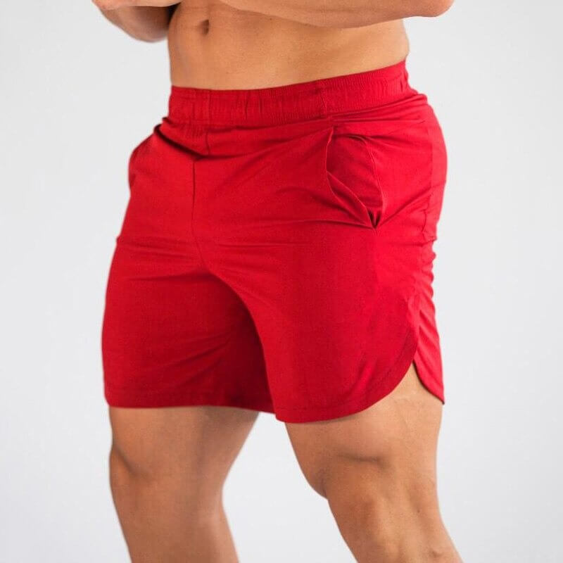 Red quick-dry gym slim shorts for men, ideal for running, workouts, and sports, featuring breathable polyester-spandex fabric.