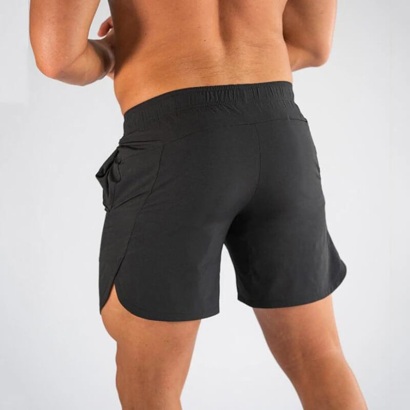Back view of model wearing black gym slim quick-dry running shorts for men, perfect for workouts like running and basketball.