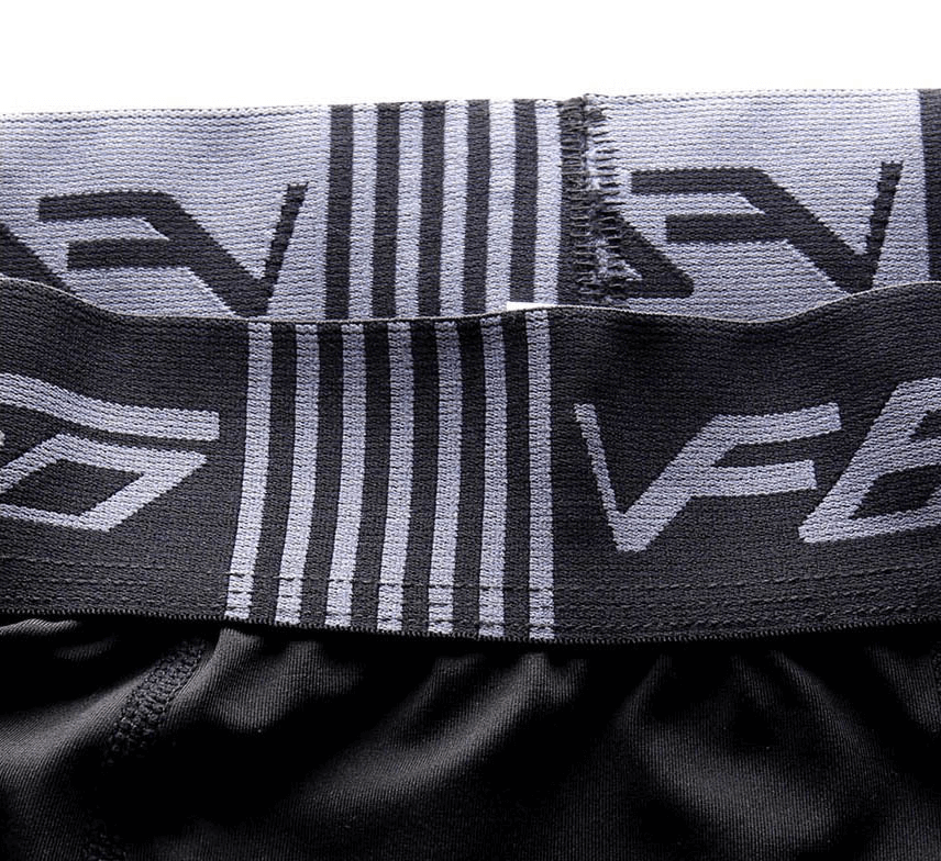 Close-up of black compression leggings waistband, featuring high elasticity and durable stitching, perfect for gym and running wear.