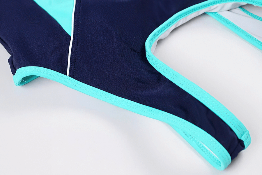 High Elastic One-piece Swimsuit in dark blue and light blue, featuring flexible nylon-spandex fabric and stylish patchwork design.