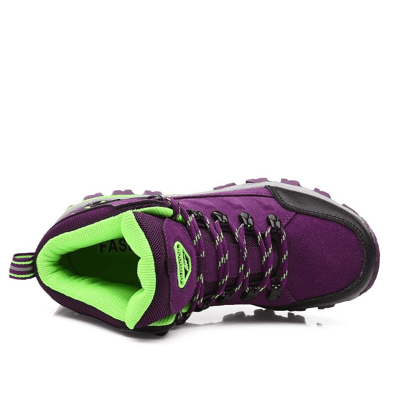 Purple and green women's mountaineering shoe with lace-up closure, rubber outsole, and breathable cotton fabric for hiking comfort.