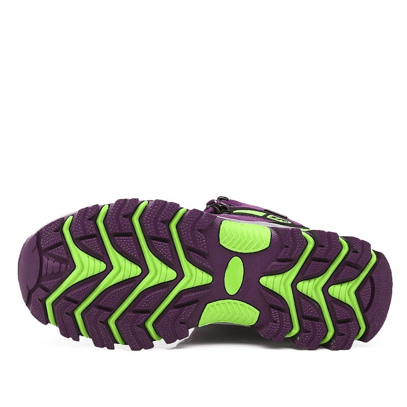 Purple and green rubber outsole of High Tourist Women's Mountaineering Shoes showing excellent grip and traction for hiking.