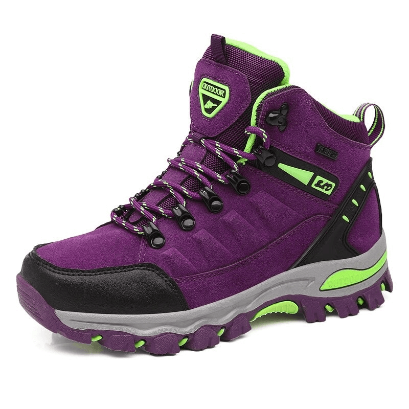 Vibrant purple women's mountaineering shoe with lace-up design and green accents for ultimate hiking comfort and traction.