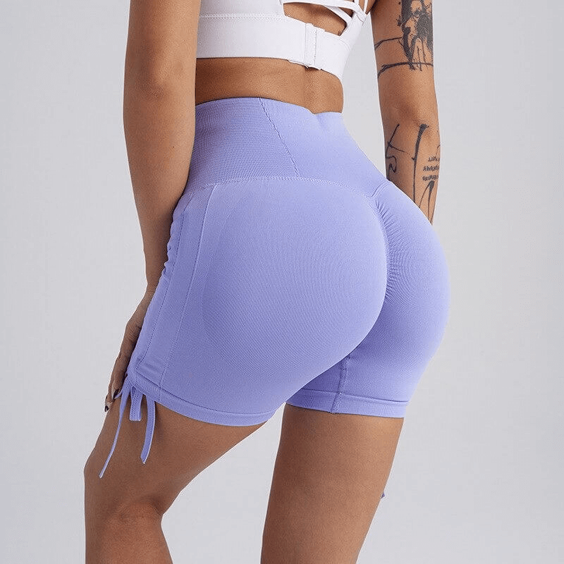 High waist drawstring sports elastic shorts for women in purple, showcasing a flattering fit. Ideal for yoga and everyday wear.