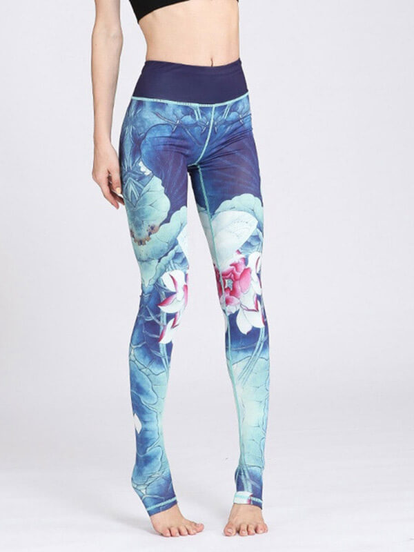Woman wearing high waist sports leggings with floral prints; full-length, nylon-spandex fabric, breathable fit. Perfect for workouts.