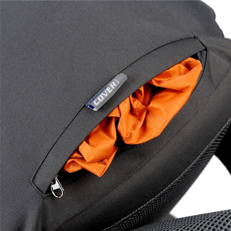 Black hiking backpack displaying orange rain cover in zippered pocket.